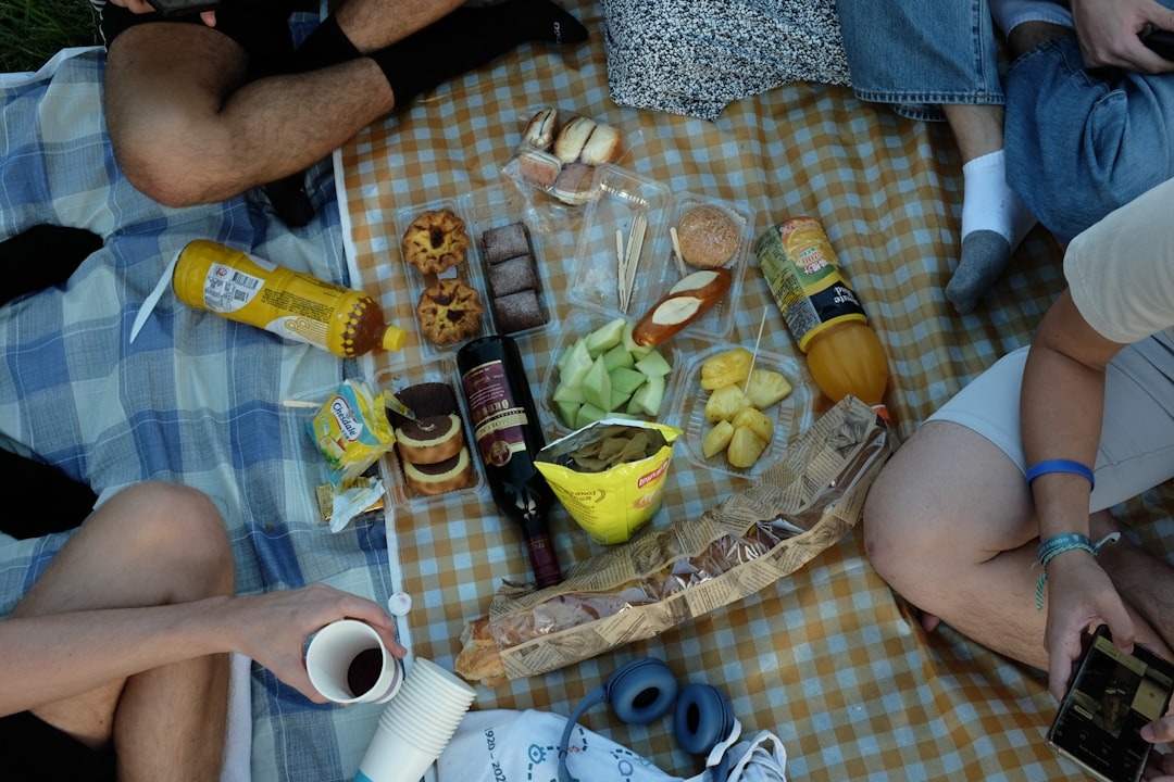 A busy picnic layout with food, drinks, bags, and a checkered table cloth behind text that says "When Good Contrast Isn't Enough